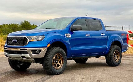 blue ford truck with tinted windows